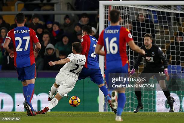 Swansea City's Spanish defender Angel Rangel shoots to score their second goal during the English Premier League football match between Crystal...