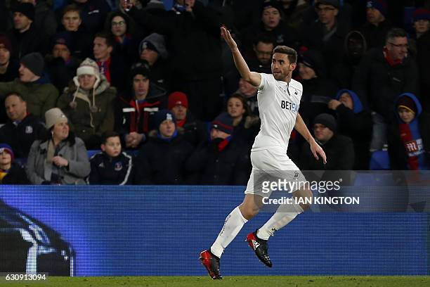 Swansea City's Spanish defender Angel Rangel celebrates after scoring their second goal during the English Premier League football match between...