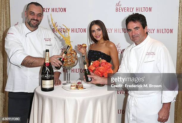 Executive Chef Alberico Nunizata, Olivia Culpo, and Executive Pastry Chef Thomas Henzi attend The Beverly Hilton unveils the menu for the 74th Annual...