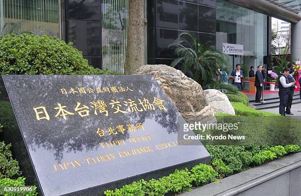 Plaque detailing the new name of Japan's de facto diplomatic establishment in Taiwan stands outside its office in Taipei on Jan. 3, 2017. The...