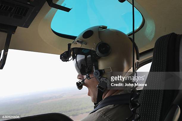 Customs and Border Protection pilot flies near the U.S.-Mexico border on January 3, 2017 near McAllen, Texas. Helicopter crews from U.S. Air and...