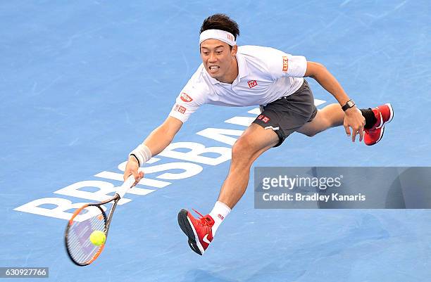 Kei Nishikori of Japan stretches out to play a forehand against Jared Donaldson of the USA on day four of the 2017 Brisbane International at Pat...