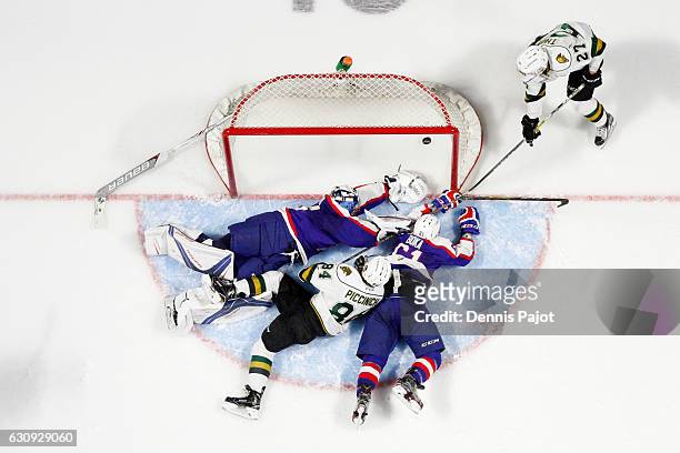 Forward Robert Thomas of the London Knights slides the puck past goaltender Michael DiPietro of the Windsor Spitfires for a goal on January 3, 2017...