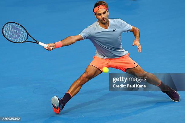 Roger Federer of Switzerland stretches to play a forehand to Alexander Zverev of Germany during the men's singles match on day four of the 2017...