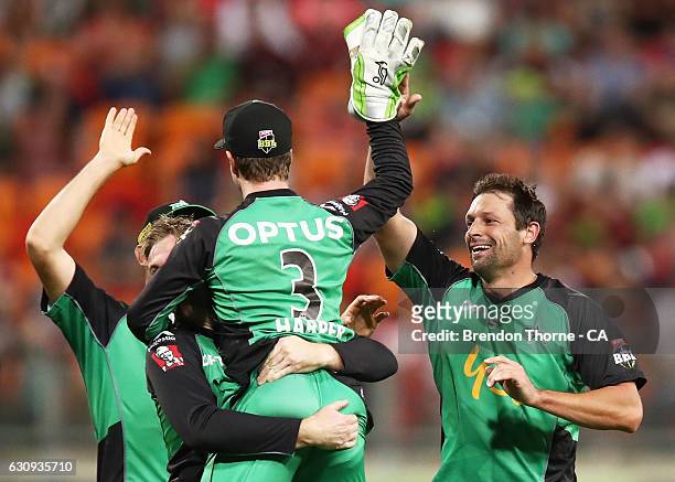 Ben Hilfenhaus of the Stars celebrates with team mates after claiming the wicket of Shane Watson of the Thunder during the Big Bash League match...