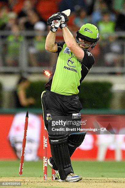 Aiden Blizzard of the Thunder is bowled out by Ben Hilfenhaus of the Stars during the Big Bash League match between the Sydney Thunder and Melbourne...