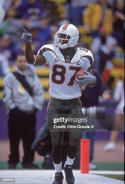 Reggie Wayne of the Miami Hurricanes celebrates in the endzone during the game against the Washington Huskies at Huskey Stadium in Seattle,...