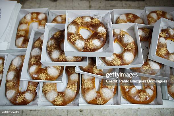 Roscones de Reyes' are placed on top of a table to cool down after baking at the Antigua Pasteleria del Pozo ahead of the Three Kings Day on January...