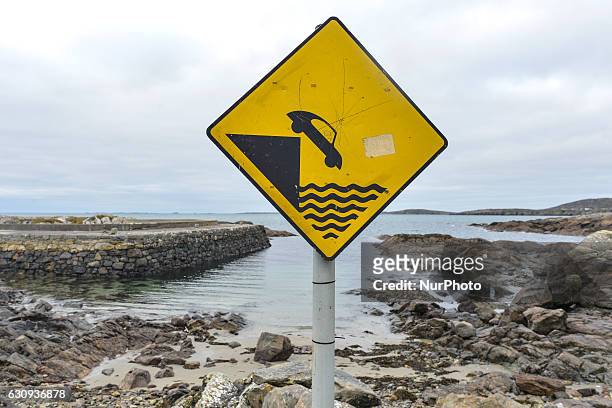 Slow down' sign seen in Errislannon village small harbour, in Connemara. On Tuesday, 3 January 2017, in Errislannon, Connemara, County Galway,...