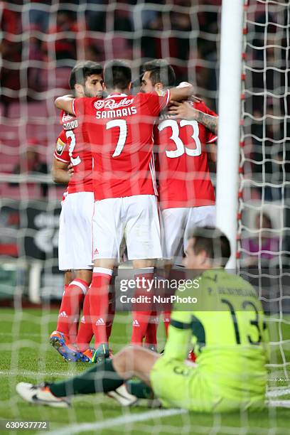 Benfica's forward Kostas Mitroglou celebrates with teammates after scoring during the Portuguese League Cup football match SL Benfica vs FC Vizela at...