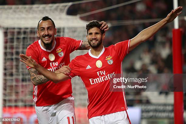 Benfica's defender Lisandro Lopez celebrates with Benfica's forward Kostas Mitroglou after scoring a goal during the Portuguese League Cup football...