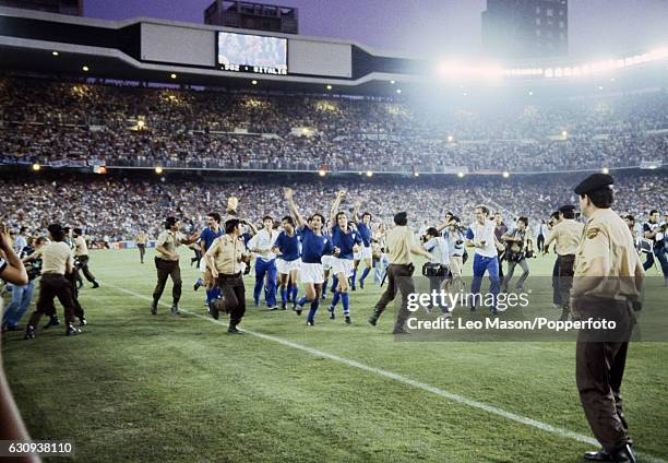 The Italian team, led by Claudio Gentile and Marco Tardelli, parade the trophy following their victory over West Germany in the FIFA World Cup Final...