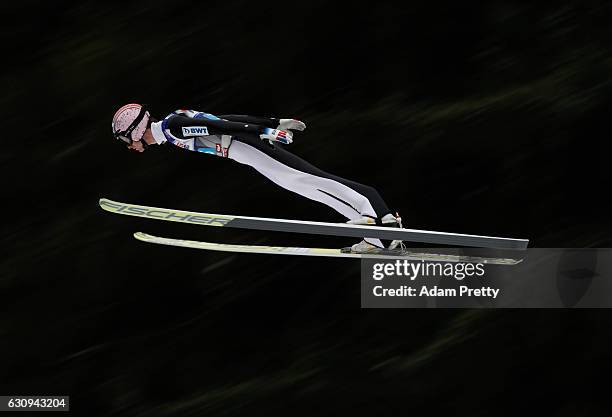 Lukas Hlava of Czech Republic soars through the air during his first competition jump on Day 2 on January 4, 2017 in Innsbruck, Austria.