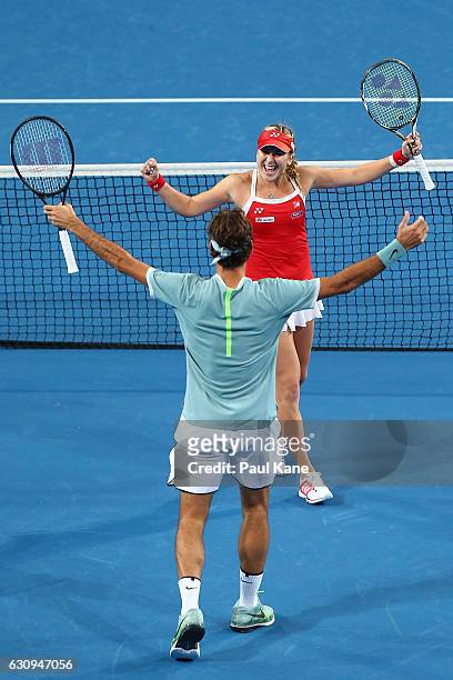 Roger Federer and Belinda Bencic of Switzerland celebrate after winning the mixed doubles match against Alexander Zverev and Andrea Petkovic of...