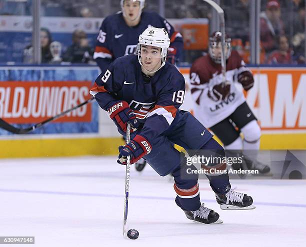 Clayton Keller of Team USA skates with the puck against Team Latvia during a preliminary game at the 2017 IIHF World Junior Hockey Championship at...