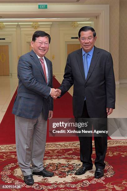 Jan. 4, 2017 -- Cambodian Prime Minister Samdech Techo Hun Sen shakes hands with Chairman of Guangzhou R&F Properties Zhang Li in Phnom Penh,...