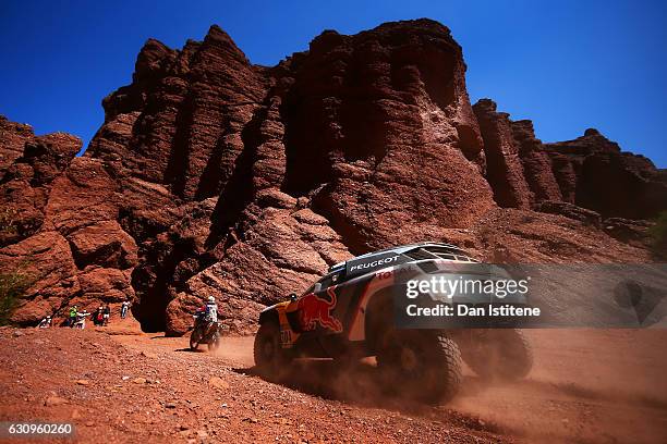 Carlos Sainz of Spain and Peugeot drives with co-driver Lucas Cruz of Spain in the 3008 DKR Peugeot car in the Classe : T1.4 2 Roues Motrices, Diesel...