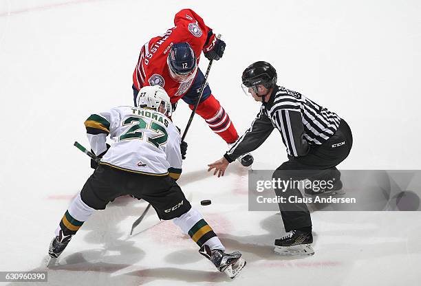 Domenic Commisso of the Oshawa Generals takes a faceoff against Robert Thomas of the London Knights during an OHL game at Budweiser Gardens on...