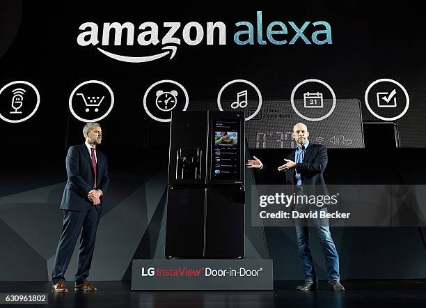 Electronics USA Vice President of Marketing David VanderWaal and Amazon Vice President of Alexa, Echo and Appstore Mike George display the LG Smart...