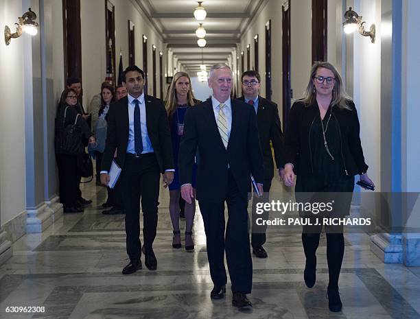 Defense Secretary nominee James Mattis walks to a private meeting with US Senator Kristen Gillibrand on January 4 on Capitol Hill in Washington, DC....