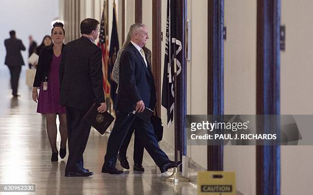 Defense Secretary nominee James Mattis walks to a private meeting with US Senator Kristen Gillibrand on January 4 on Capitol Hill in Washington, DC....