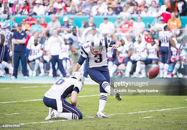 New England Patriots Kicker Stephen Gostkowski kicks the ball for a field goal as New England Patriots Punter Ryan Allen holds the ball during the...
