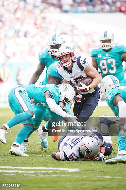 New England Patriots Wide Receiver Chris Hogan runs with ball and is tackled by Miami Dolphins Safety Baccarri Rambo and Miami Dolphins Defensive...