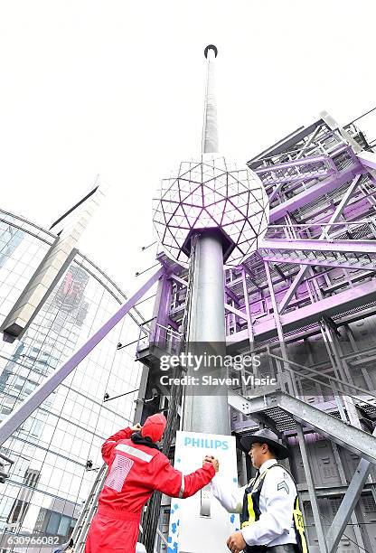 The iconic Times Square New Year's Eve Ball, which dropped to usher in 2017, is once again sent back up the 130-foot pole atop One Times Square,...