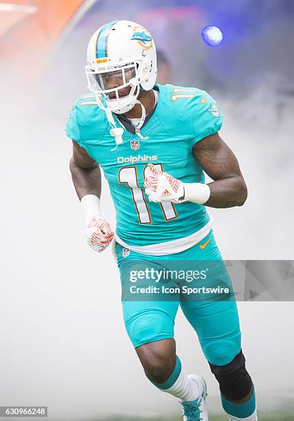 Miami Dolphins Wide Receiver DeVante Parker runs onto the field during the NFL football game between the New England Patriots and the Miami Dolphins...