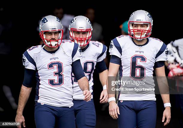 New England Patriots Kicker Stephen Gostkowski and New England Patriots Punter Ryan Allen walk onto the field during the NFL football game between...