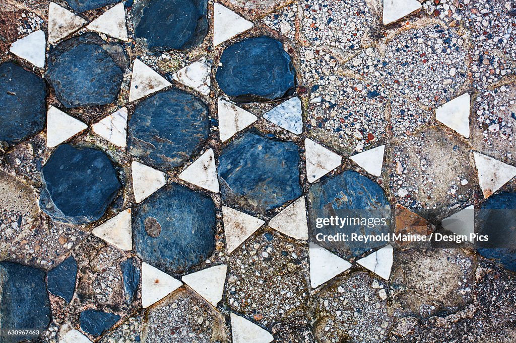 Broken tile in the shape of stars on the ground