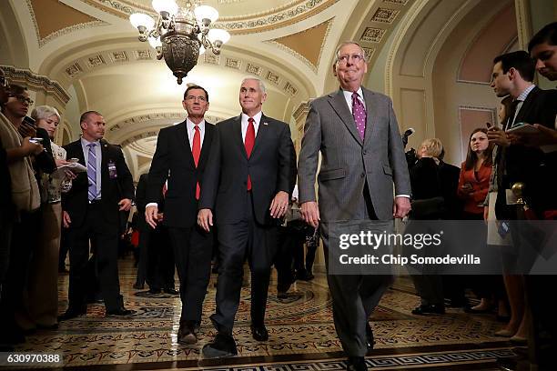 Vice President-elect Mike Pence , Senate Majority Leader Mitch McConnell and Sen. John Barrasso arrive for a news conference in the U.S. Capitol...