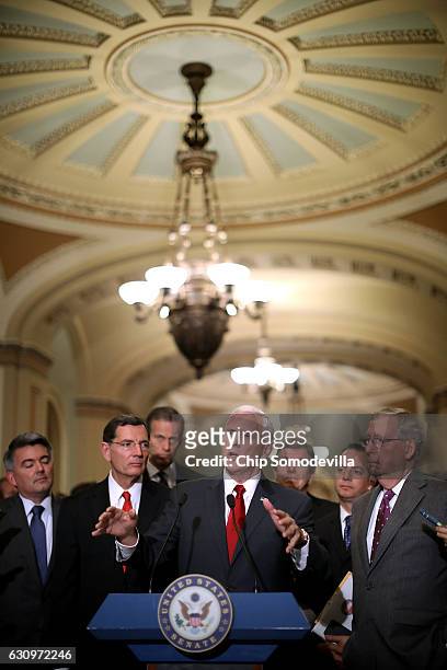 Vice President-elect Mike Pence talks to reporters with Sen. Corey Gardner , Sen. John Barrasso , Sen. John Thune , Sen. Roy Blunt , Trump White...