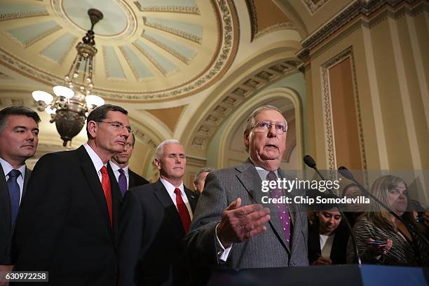 Senate Majority Leader Mitch McConnell speaks with reporters following a GOP caucus meeting with Sen. Corey Gardner , Sen. John Barrasso , Sen. John...