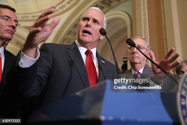 Vice President-elect Mike Pence speaks with reporters along with Sen. John Barrasso and Senate Majority Leader Mitch McConnell following a GOP caucus...