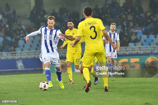 Zurutuza of Real Sociedad duels for the ball with J. Angel of Villarreal during the Spanish Kings Cup round of 8 finals first leg football match...