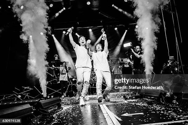 Heiko Lochman and his twin brother Roman of Die Lochis are awarded the Goldene Kamera Digital Award on stage during a concert at Columbiahalle on...