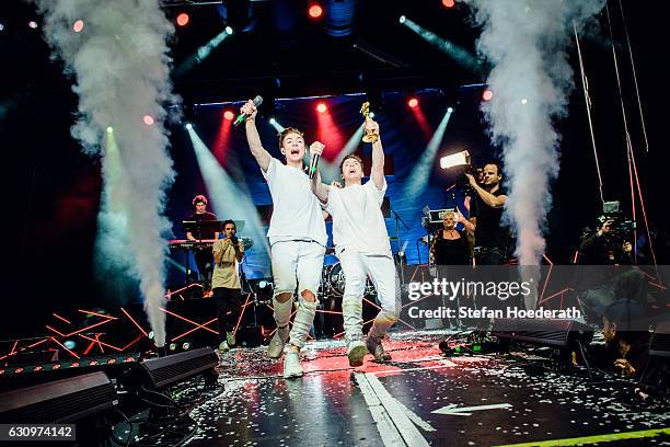 Heiko Lochman and his twin brother Roman of Die Lochis are awarded the Goldene Kamera Digital Award on stage during a concert at Columbiahalle on...