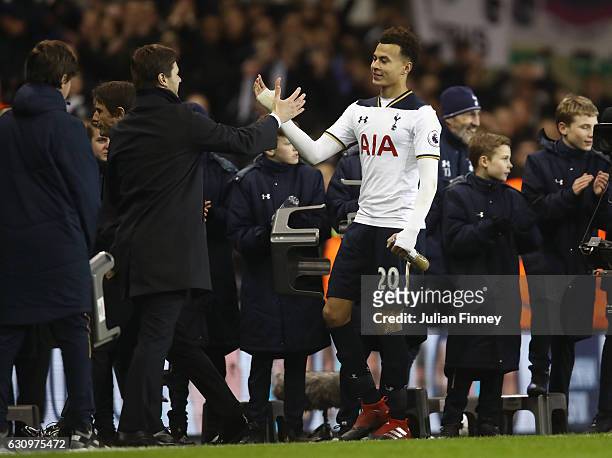 Mauricio Pochettino, Manager of Tottenham Hotspur and Dele Alli of Tottenham Hotspur embrace after the Premier League match between Tottenham Hotspur...