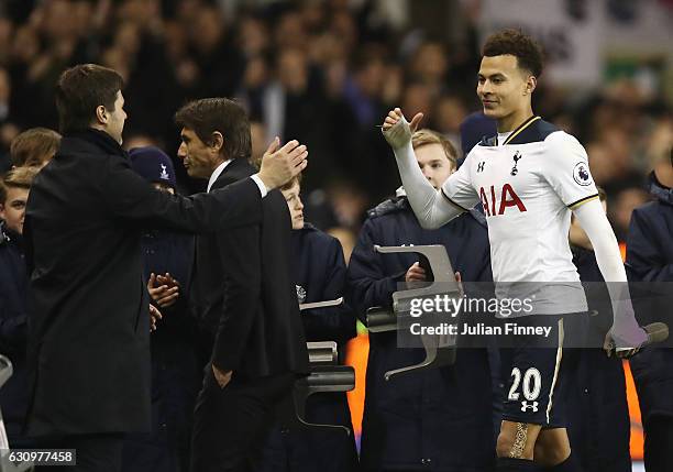 Mauricio Pochettino, Manager of Tottenham Hotspur and Dele Alli of Tottenham Hotspur embrace after the the Premier League match between Tottenham...