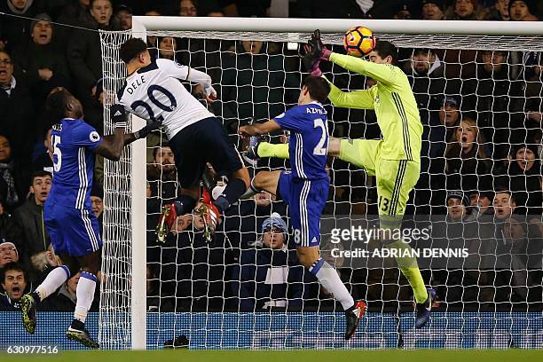 Tottenham Hotspur's English midfielder Dele Alli jumps to score his and Totenham's second goal with this header during the English Premier League...