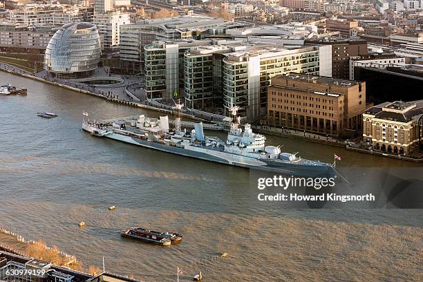 hms belfast on the thames - hms belfast stock-fotos und bilder