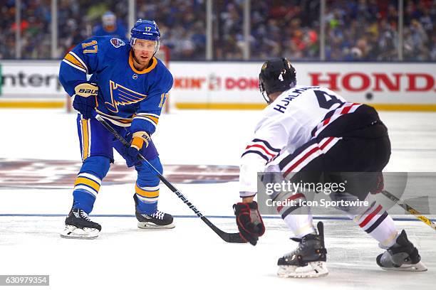 St. Louis Blues left wing Jaden Schwartz skates with the puck during a NHL Winter Classic hockey game between the St. Louis Blues and the Chicago...