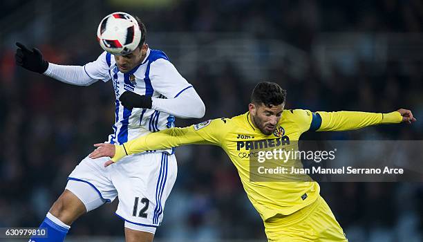 Willian Jose Da Silva of Real Sociedad duels for the ball with Mateo Musacchio of Villarreal CF during the Copa del Rey Round of 16 first leg match...