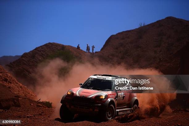 Mikko Hirvonen of Finland and Mini X-Raid drives with co-driver Michel Perin of France in the John Cooper Works Rally Mini car in the Classe : T1.2 :...