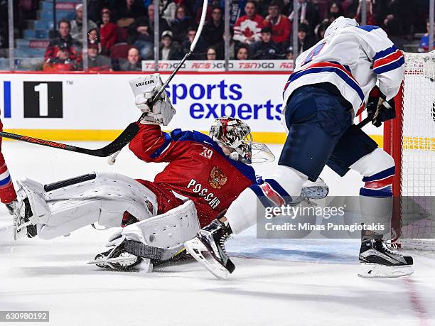 Goaltender Ilya Samsonov of Team Russia makes a save on Caleb Jones of Team United States during the 2017 IIHF World Junior Championship semifinal...