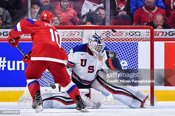 Tyler Parsons of Team United States makes a save on Alexander Polunin of Team Russia during the 2017 IIHF World Junior Championship semifinal game at...