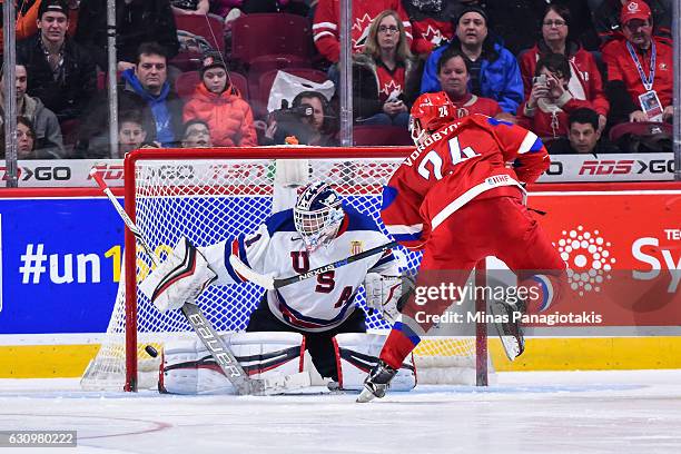 Mikhail Vorobyev of Team Russia scores on goaltender Tyler Parsons of Team United States in a shootout during the 2017 IIHF World Junior Championship...