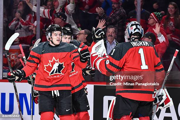 Mitchell Stephens of Team Canada celebrates his first period goal with goaltender Connor Ingram during the 2017 IIHF World Junior Championship...