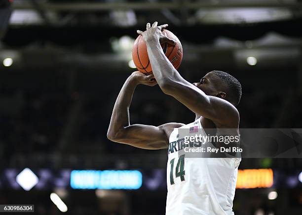 Eron Harris of the Michigan State Spartans shoots a three pointer in the first half against the Rutgers Scarlet Knights at the Breslin Center on...